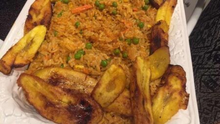 Nigerian Jollof Rice with Chicken and Fried Plantains